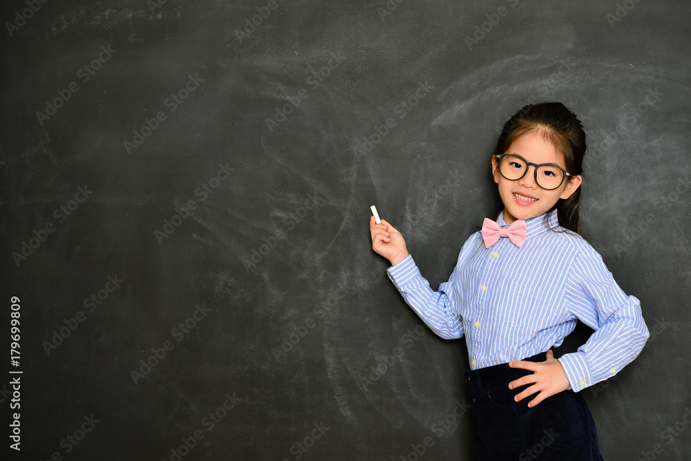 smiling little teacher standing in blackboard smiling little teacher standing in blackboard
