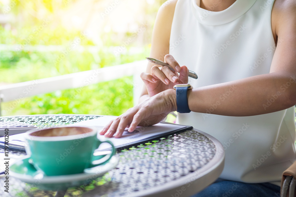 business woman hand working using laptop on table in garden. business woman hand working using laptop on table in garden.