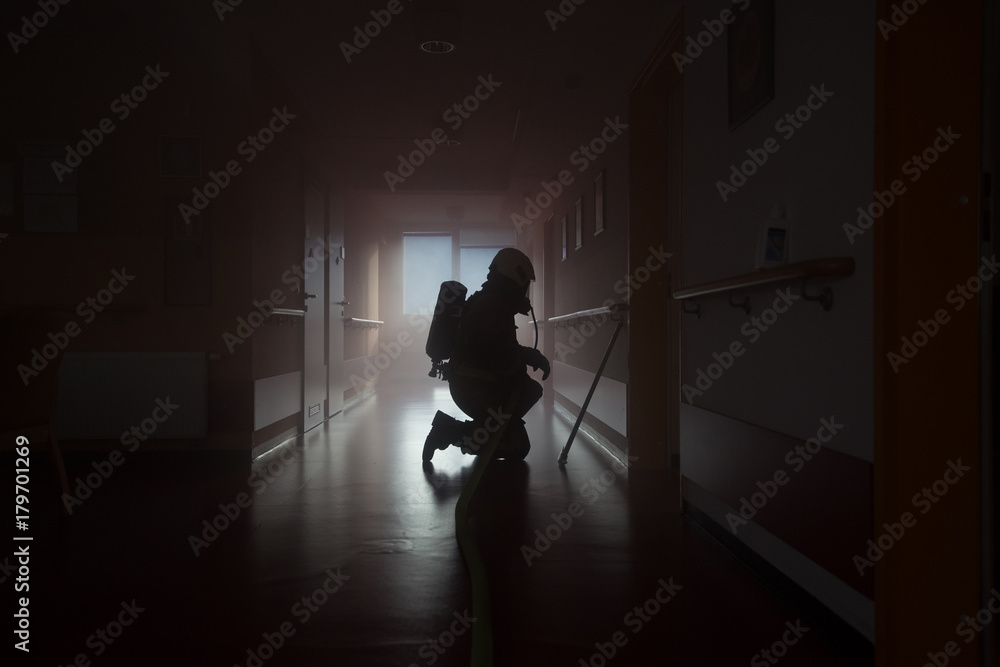 Fototapeta premium Firefighter in action. Fire department training.