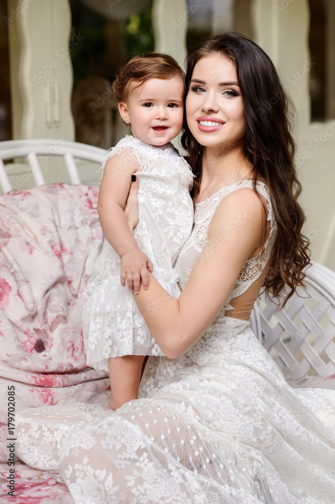 Mom and child in amazing dresses outdoor