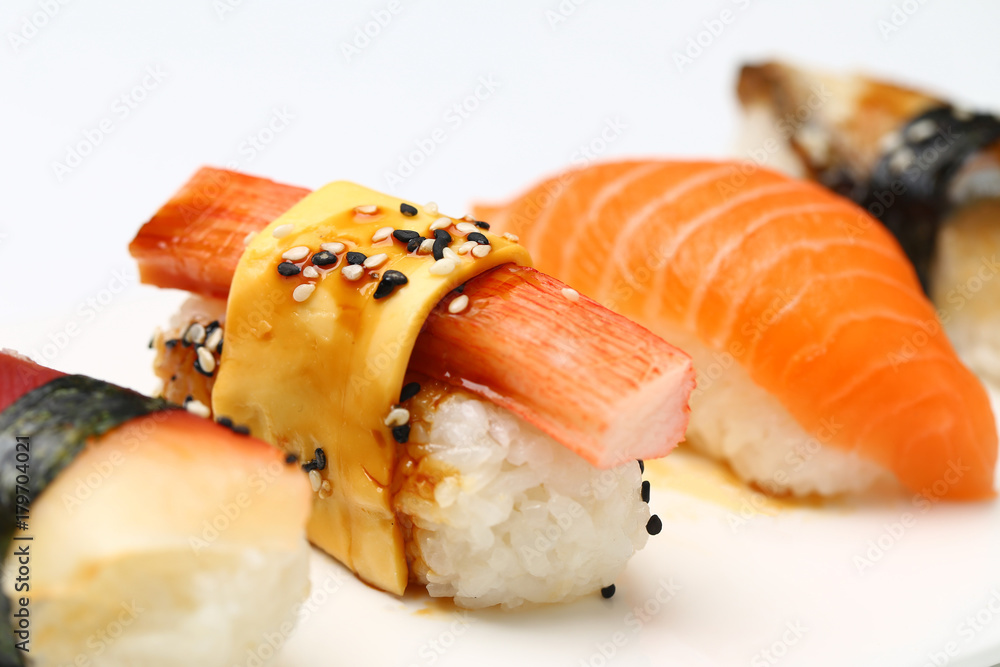 assorted sushi on white plate isolated on white back ground assorted sushi on white plate isolated on white back ground