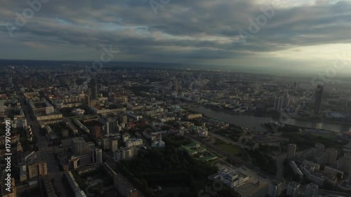 Wallpaper Mural Beautiful and amazing view over the town. You can see the streets, the houses, the big skyscraper, the sun's rays burst through the clouds Torontodigital.ca