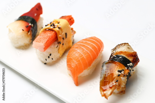 assorted sushi on white plate isolated on white back ground