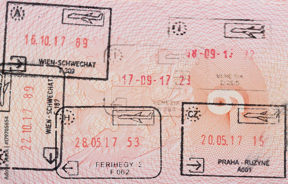 Obraz premium Inside page of a well traveled russian passport with stamps from different european customs: Hungary, italy, Austria, Czech Republic.