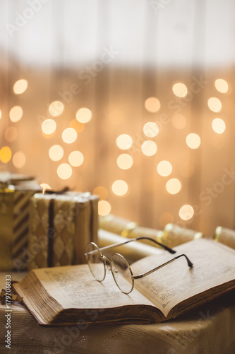 Holy bible book with eyeglasses