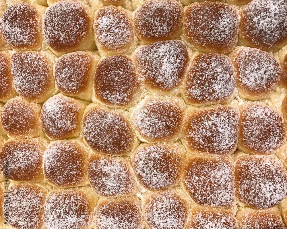 Fototapeta premium Baked bread topped with icing sugar