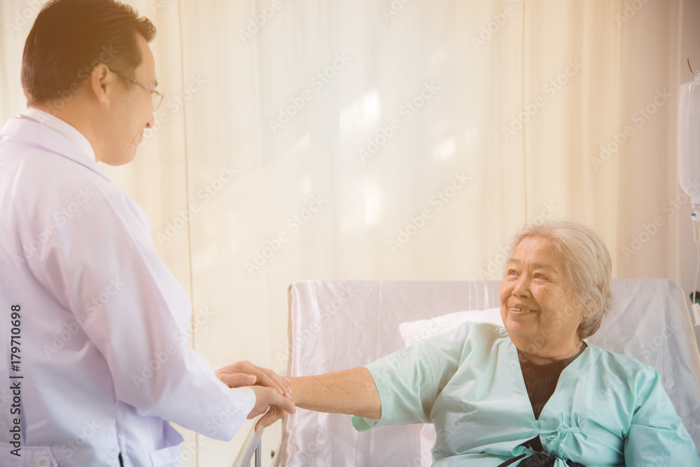Doctor give moral to old patient Doctor give moral to old patient