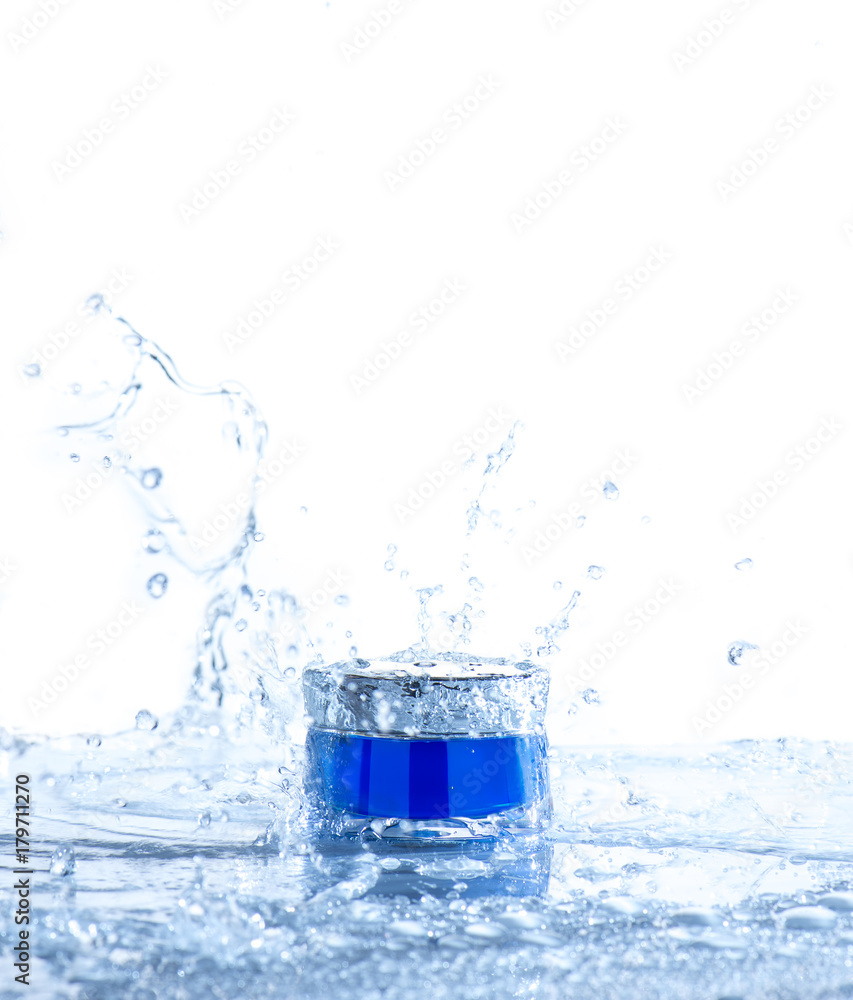 Cream pot drop and water splash. Concept beauty and felling fresh Cream pot drop and water splash. Concept beauty and felling fresh