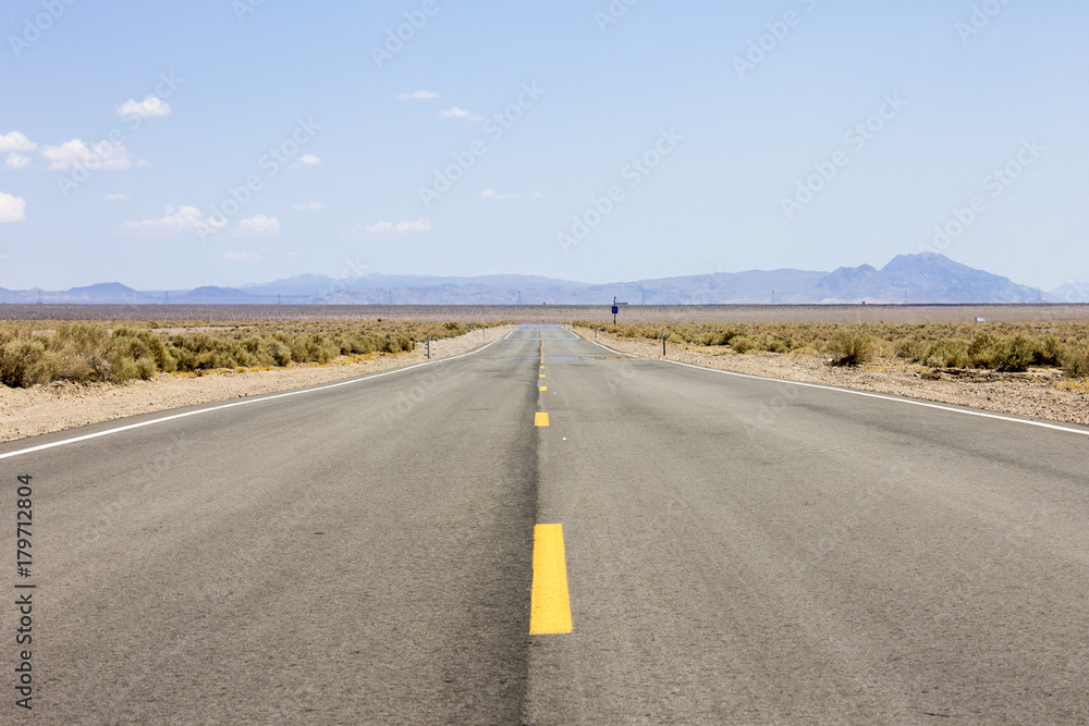 One of the roads that crosses Death Valley National Park, a desert valley located in Eastern California and one of the hottest places in the world One of the roads that crosses Death Valley National Park, a desert valley located in Eastern California and one of the hottest places in the world