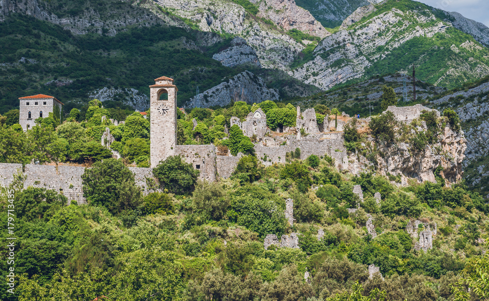 Clock tower and ruins of citadel in Stari Bar town near Bar city, Montenegro