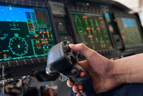 Close Up Pilot Holding Joystick In Helicopter Cockpit