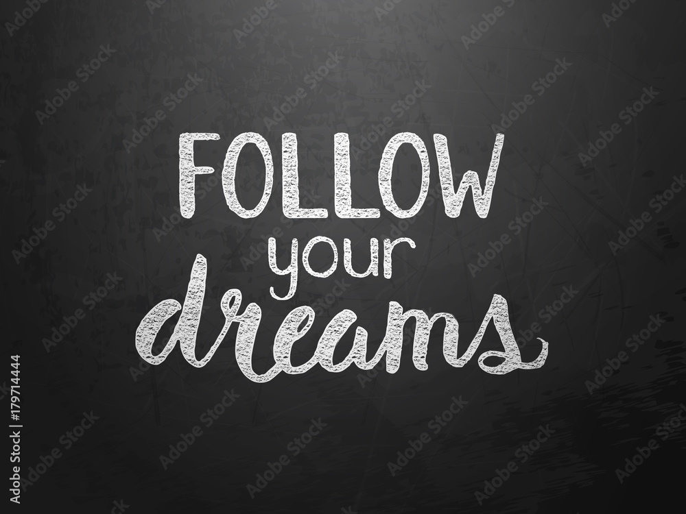 Fototapeta premium FOLLOW YOUR DREAMS motivational quote written on blackboard