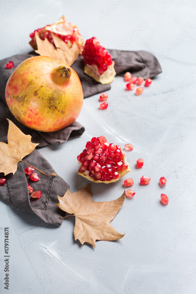 Harvest fall autumn concept. Ripe juicy pomegranate