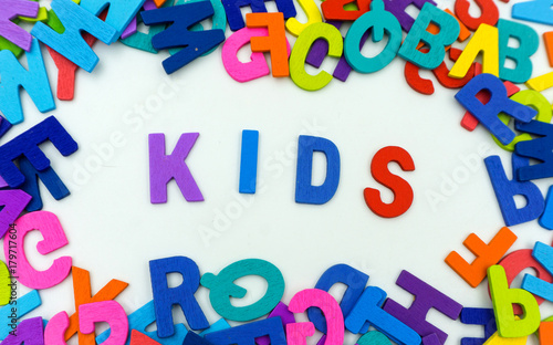 The letters made of plywood the words kids are on a white background