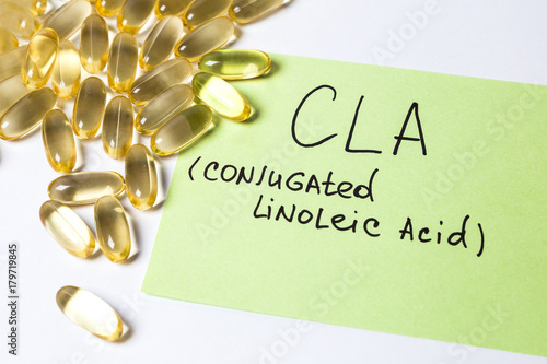 omega 6: conjugated linoleic acid (CLA) in capsules on the white background photo