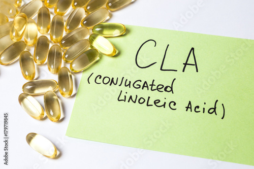 omega 6: conjugated linoleic acid (CLA) in capsules on the white background