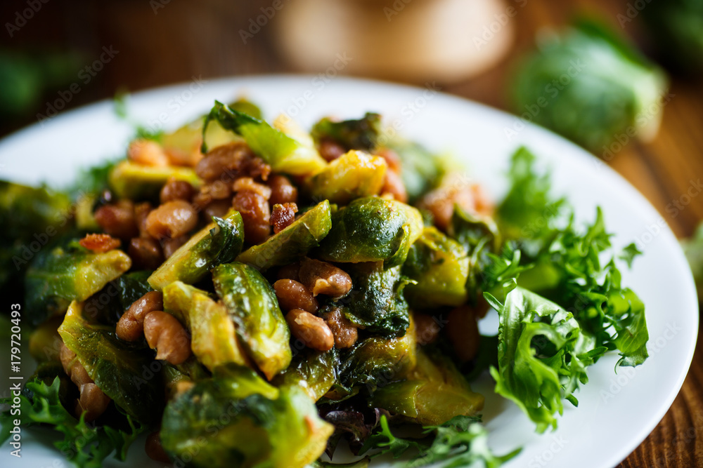 Brussels sprouts fried with beans close-up