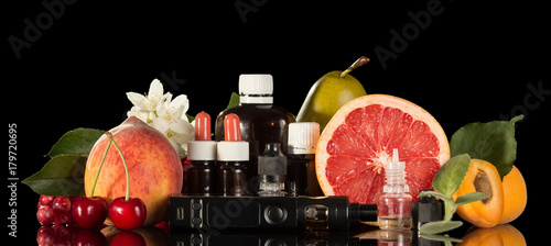 Fényképezés Electric cigarette, set of various liquids for smoking and fresh fruit isolated