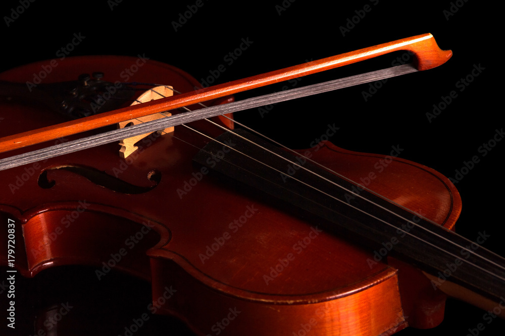 Fototapeta premium Violin and bow isolated on black