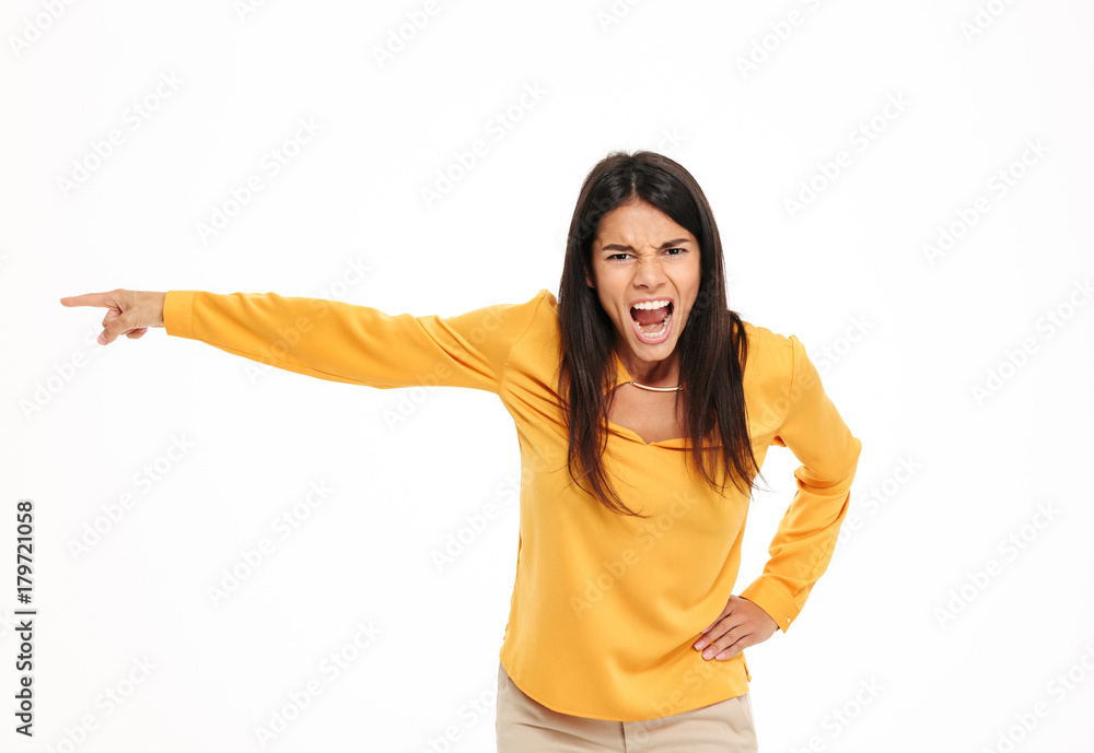 Screaming displeased young lady pointing. Screaming displeased young lady pointing.