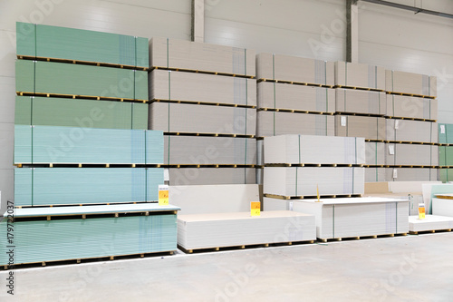 Canvas-taulu gypsum board stacks at indoor warehouse