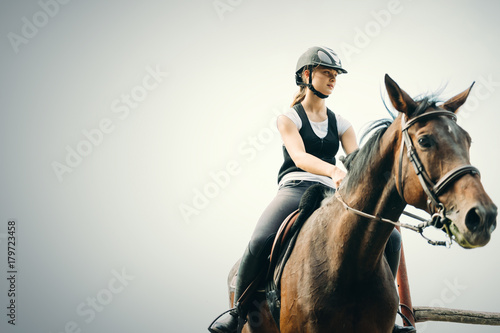 Picture of young girl riding her horse © NDABCREATIVITY