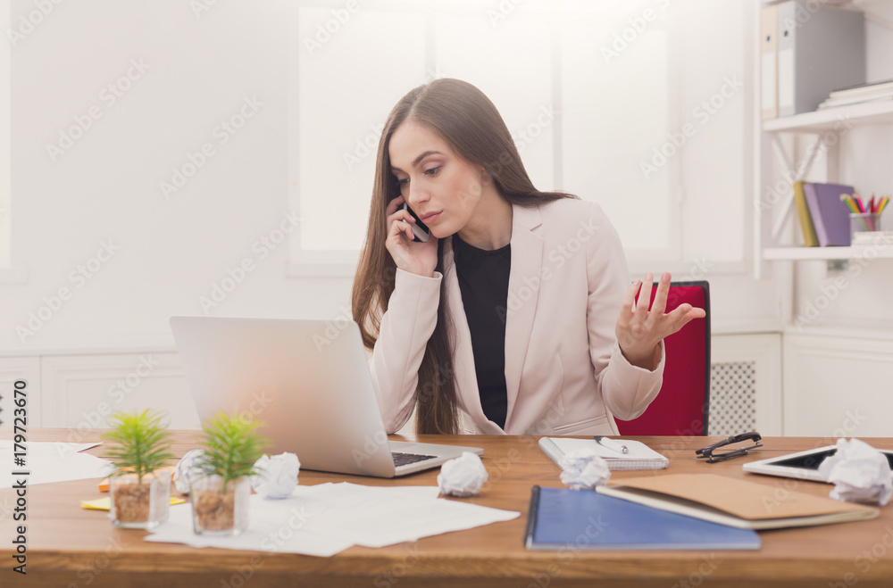 Business talk, woman consulting by phone at office Business talk, woman consulting by phone at office
