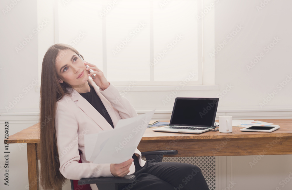 Business talk, woman consulting by phone at office Business talk, woman consulting by phone at office