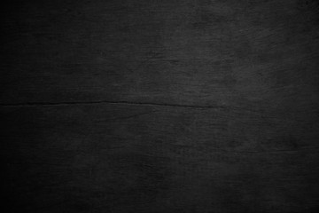 Black wood texture or background.