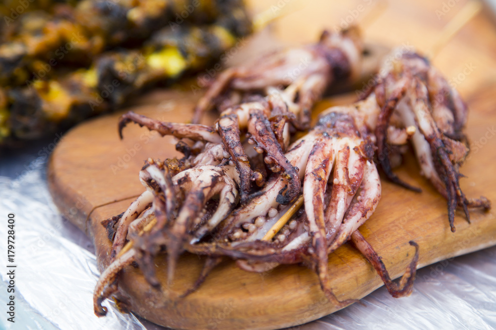 Barbeque seafood, grilled octopus at a street market Barbeque seafood, grilled octopus at a street market