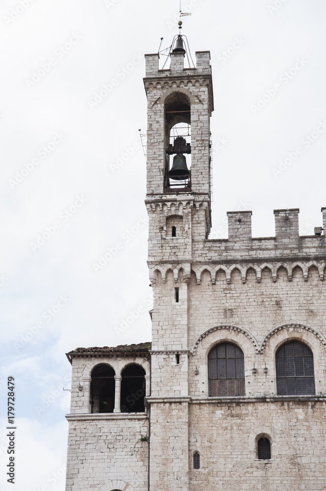 Gubbio, Perugia, Italy - the bell tower of Palazzo dei Consoli. The palace  is located in Piazza Grande, in Gubbio, and is one of the most impressive public buildings in Italy.