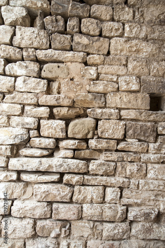 Gubbio, Perugia, Italy - ancient wall in a small typical street of the Gubbio village.