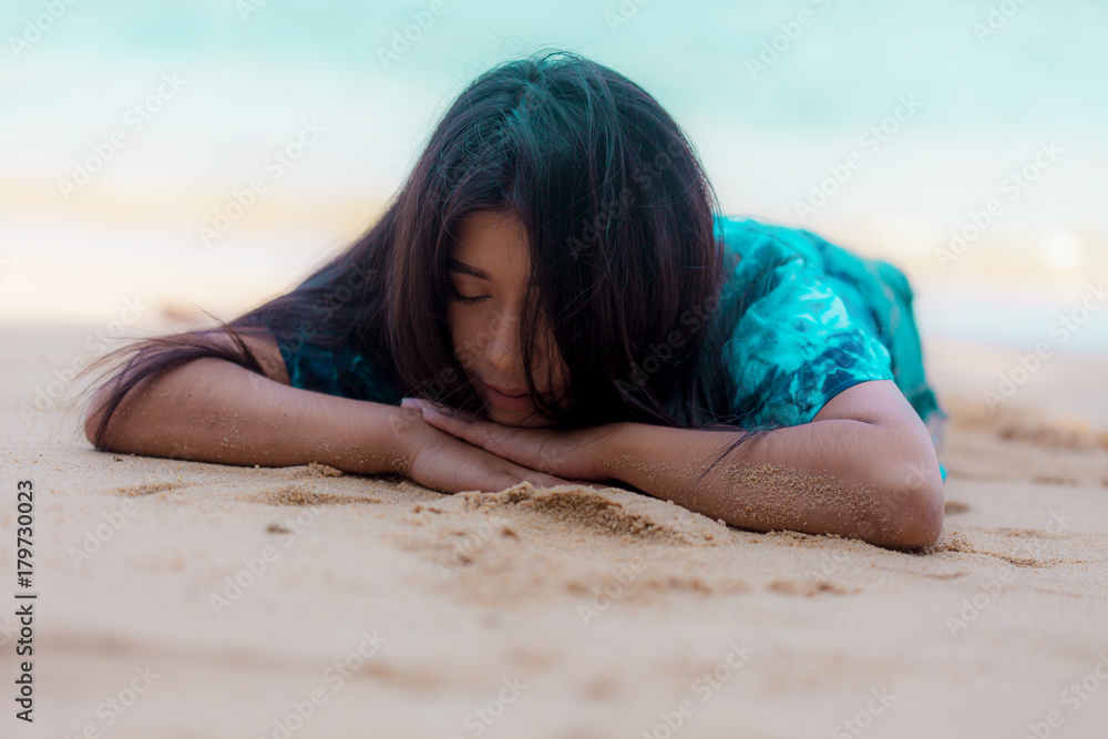 portrait sexy asian woman posing sleeping on the beach for relax portrait sexy asian woman posing sleeping on the beach for relax