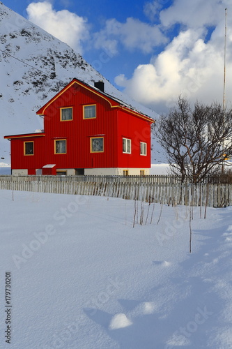 Red wooden cottage beside E10 European road. Vareid-Flakstadoya-Lofoten-Norway. 0529 © rweisswald