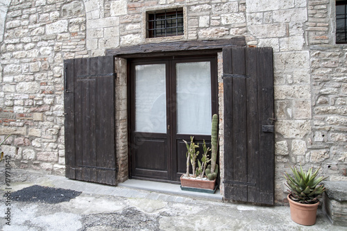 Gubbio, Perugia, Italy -  entrance door, architectural details of the ancient palaces