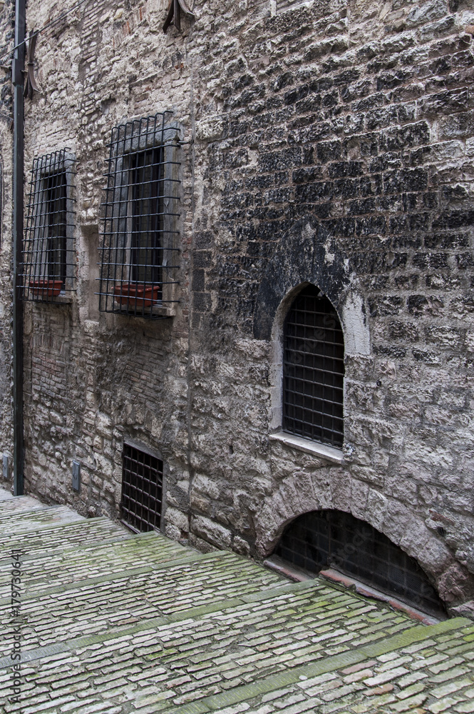 Gubbio, Perugia, Italy - small typical street of the Gubbio village. Gubbio, Perugia, Italy - small typical street of the Gubbio village.
