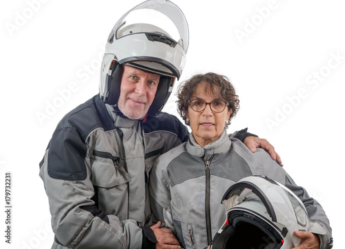 couple senior riders with helmet isolated on the white background