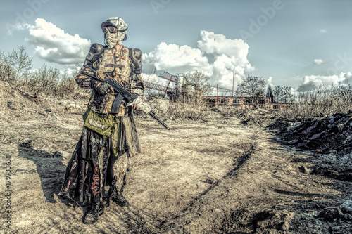 Post apocalyptic survivor creature with homemade weapons photo