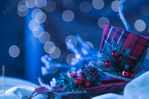 Snowy Blue Holiday Snow Sled Christmas Ornament Background. Selective Focus With Copy Space. photo