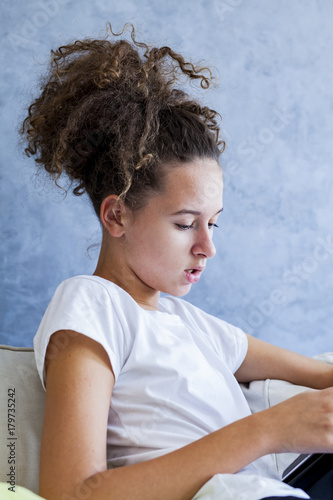 Curly hair girl using digit...