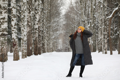 Beautiful girl in a beautiful winter park