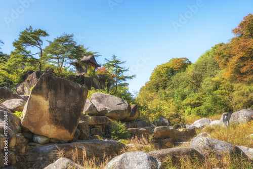 Small ancient tea house in Nezame-no-toko Gorge in autumn. Agematsu, Kiso District, Nagano Prefecture, Japan. 