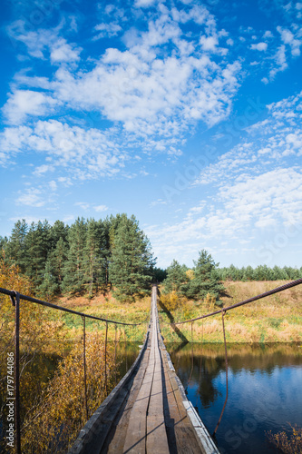 Bridge over the river and the autumn nature around