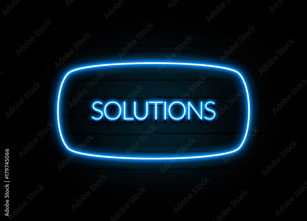 Solutions  - colorful Neon Sign on brickwall