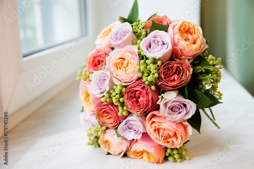 Beautiful bridal bouquet on the window sill