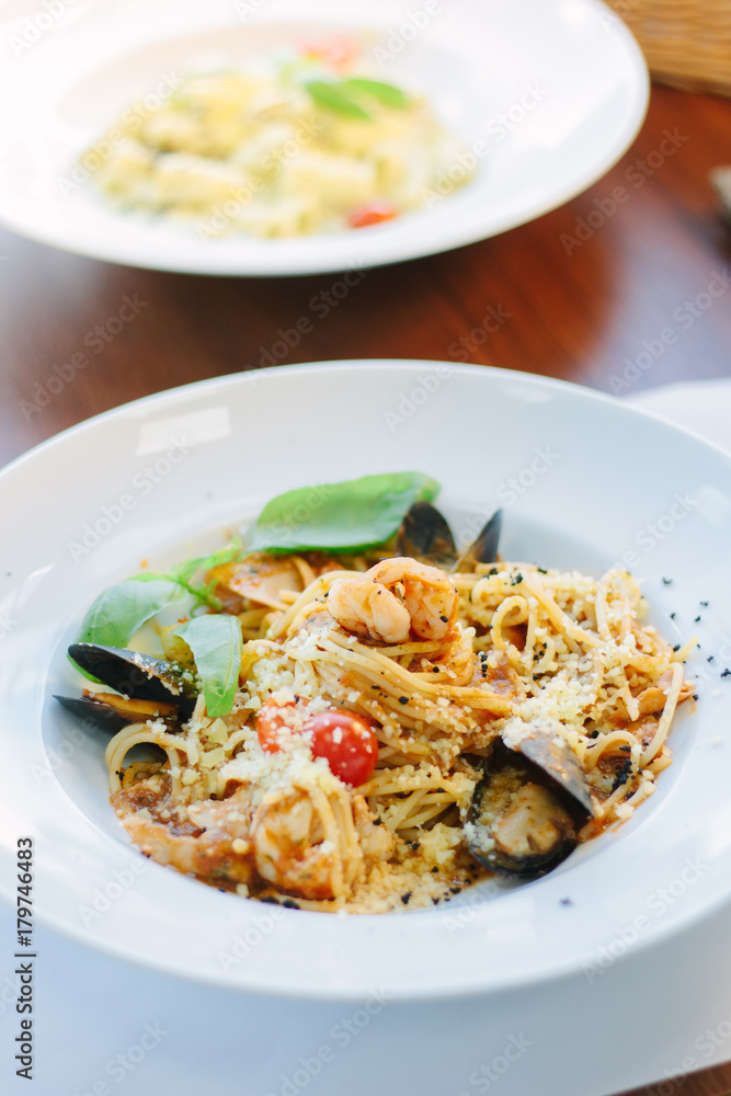Italian food - spaghetti pasta with seafood - mussels and shrimps. Italian food - spaghetti pasta with seafood - mussels and shrimps.