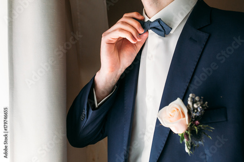 Boutonniere on the lapel of the groom photo