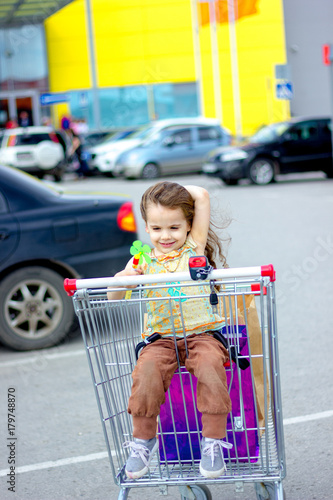 Little kid girl sitting in ...