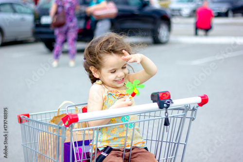 Little kid girl sitting in ...