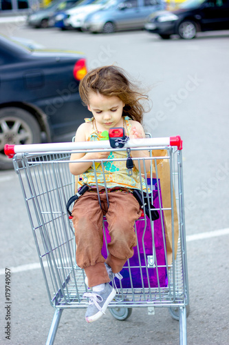 Little kid girl sitting in ...